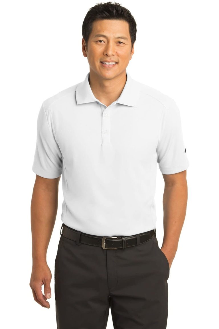 A light grey Nike Dri-FIT Classic Polo shirt on a man, paired with dark trousers. The shirt features a logo.