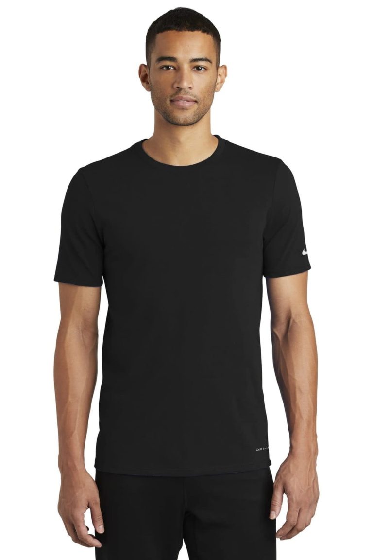 A black Nike Dri-FIT cotton/polyester t-shirt displayed on a model, featuring short sleeves and a logo.